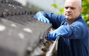 cleaning and inspecting Kete roofs